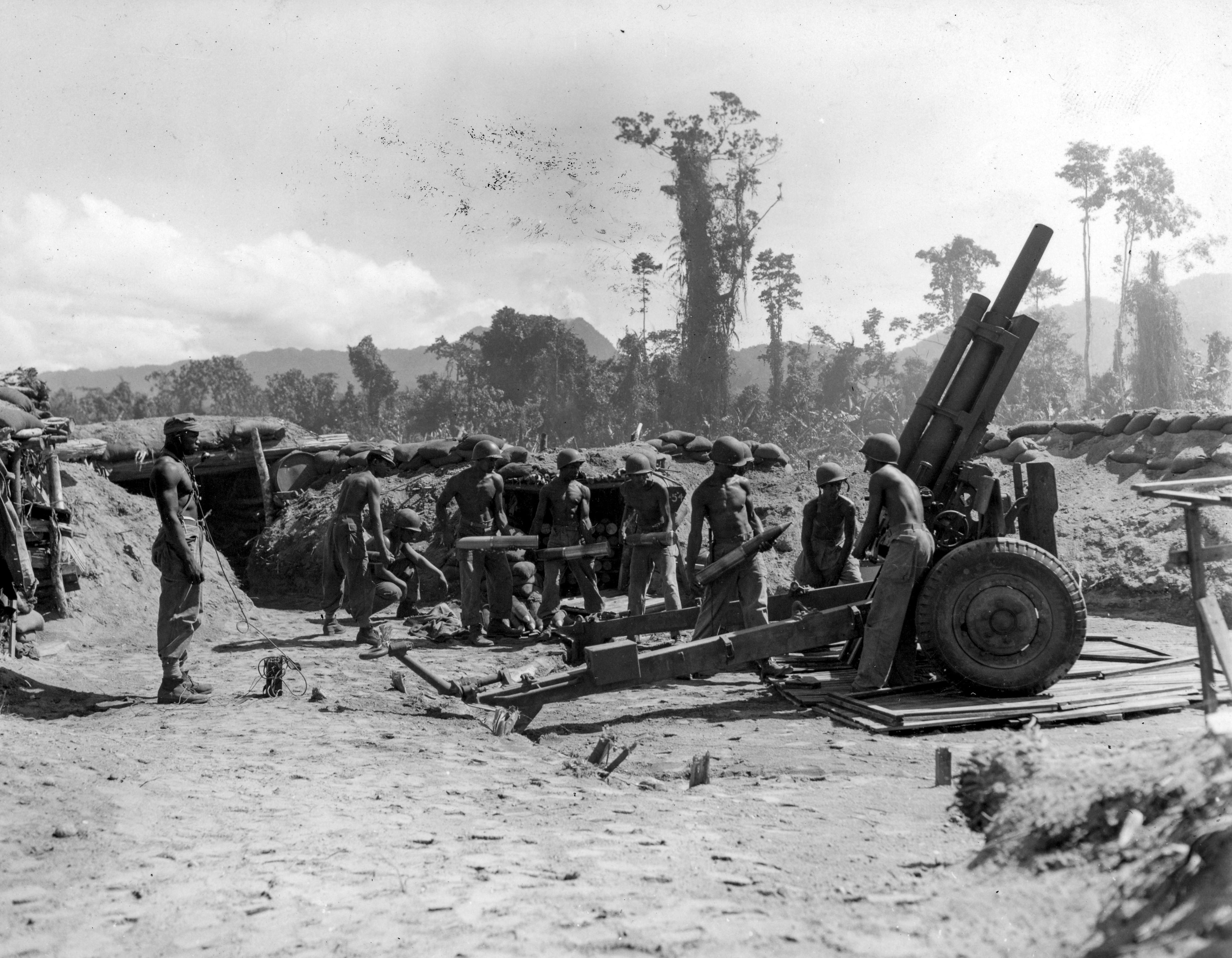 The front of a postcard featuring Black American soldiers of the 593rd Field Artillery Battalion.