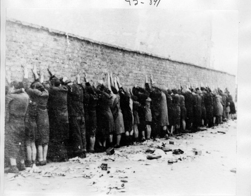 An historical image of Jewish people about to be executed during World War II