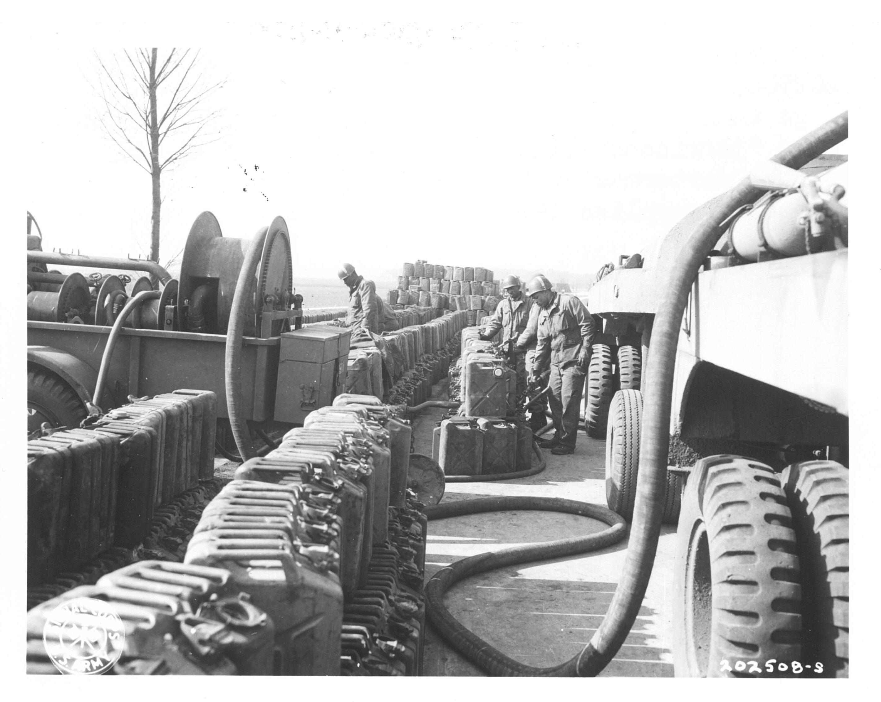 Historical image showing Soldiers of the 218th Quartermaster Battalion are fueling jerricans. of Black American soldiers during WWII