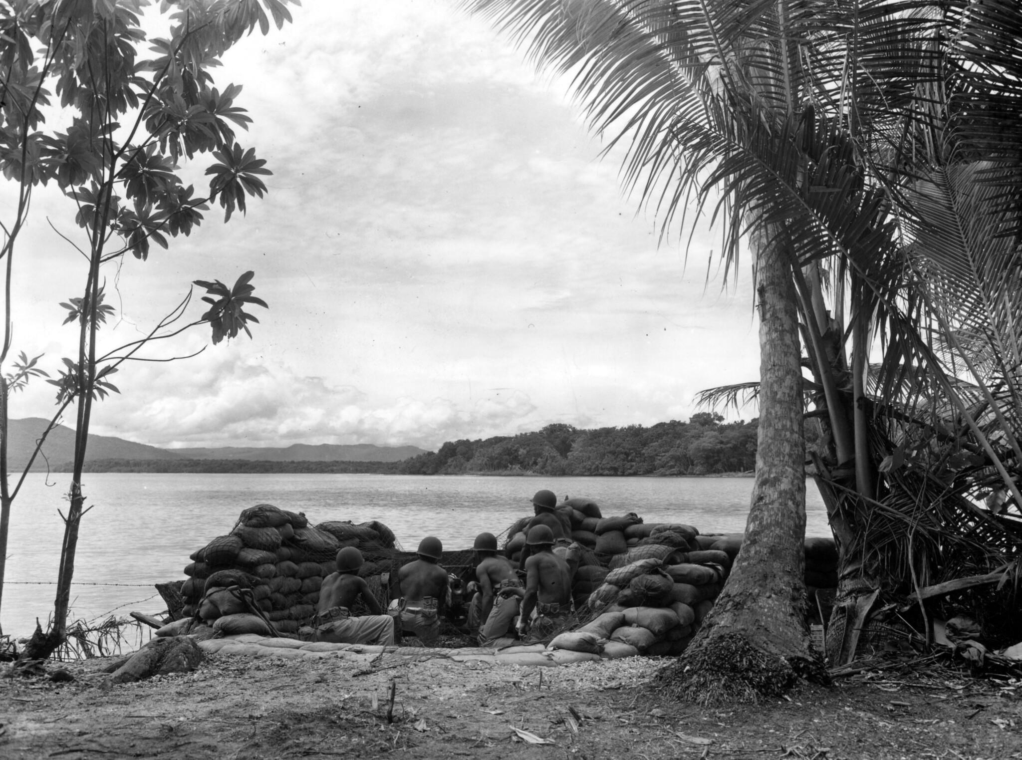 Historical image showing Soldiers of the 24th Infantry Regiment man a 37mm gun of Black American soldiers during WWII