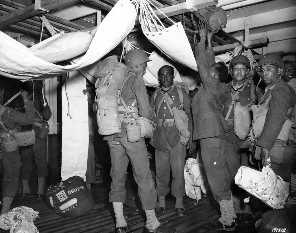 Historical image showing Members of a Medical Detachment, 352nd Engineer Regiment, prepare for their overseas journey. of Black American soldiers during WWII