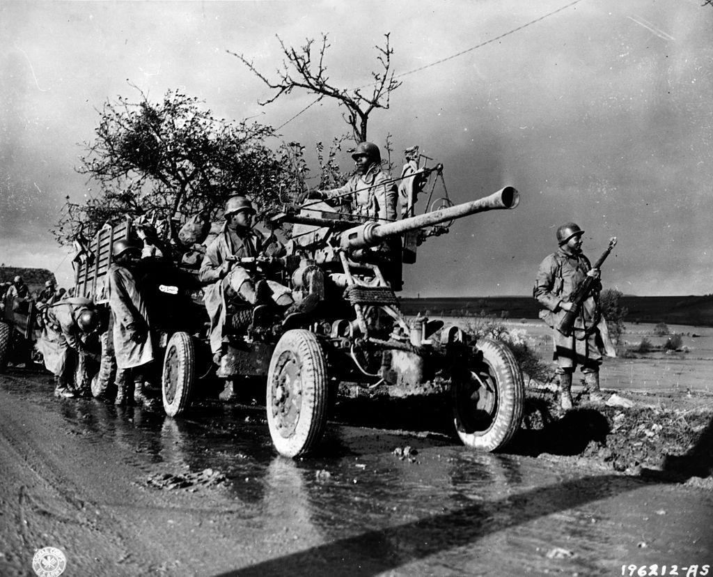 Historical image showing A 40-mm Bofors gun of the 452nd Anti Aircraft-Artillery Battalion of Black American soldiers during WWII