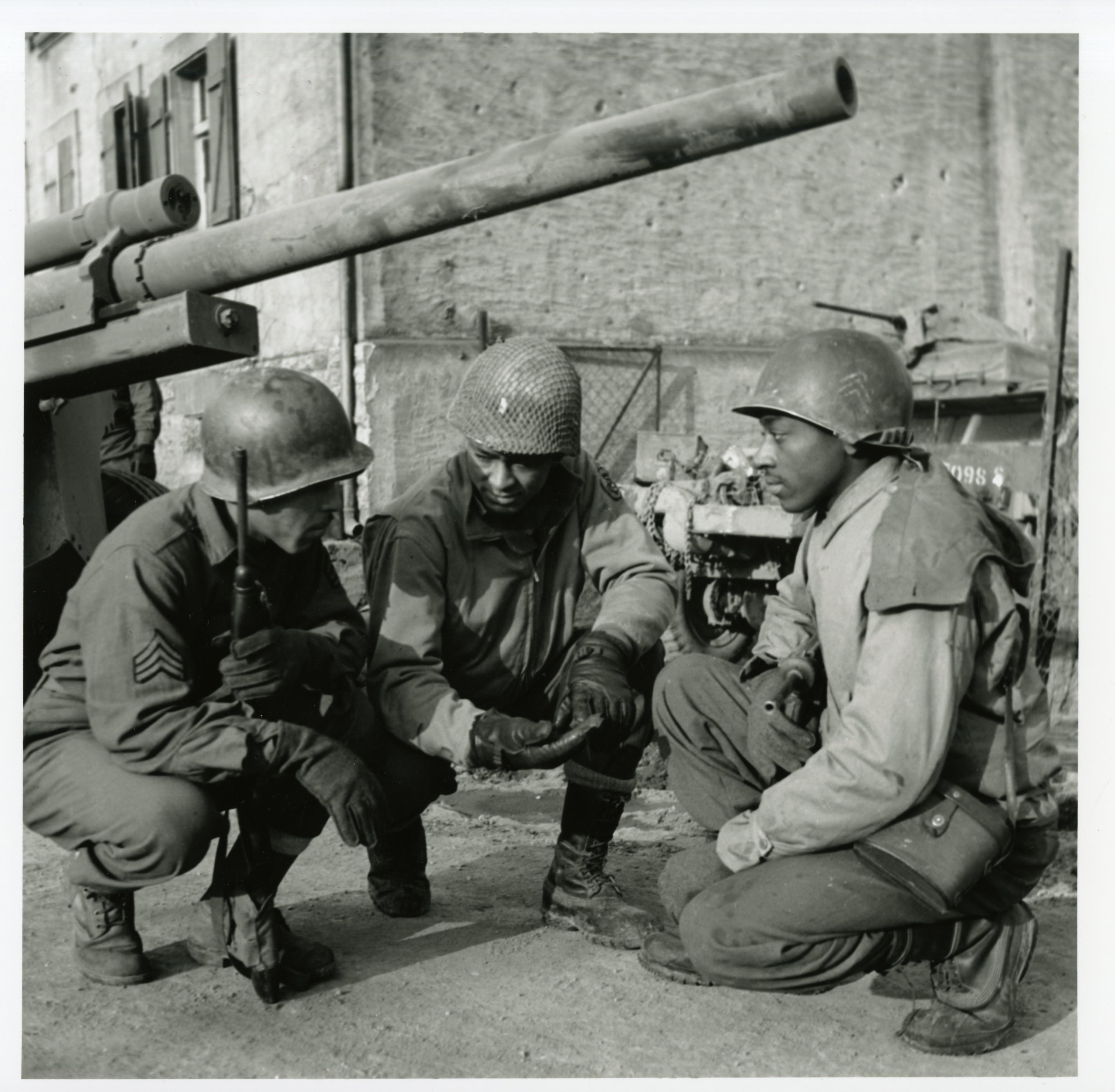 Historical image showing The 614th Tank Destroyer Battalion of Black American soldiers during WWII