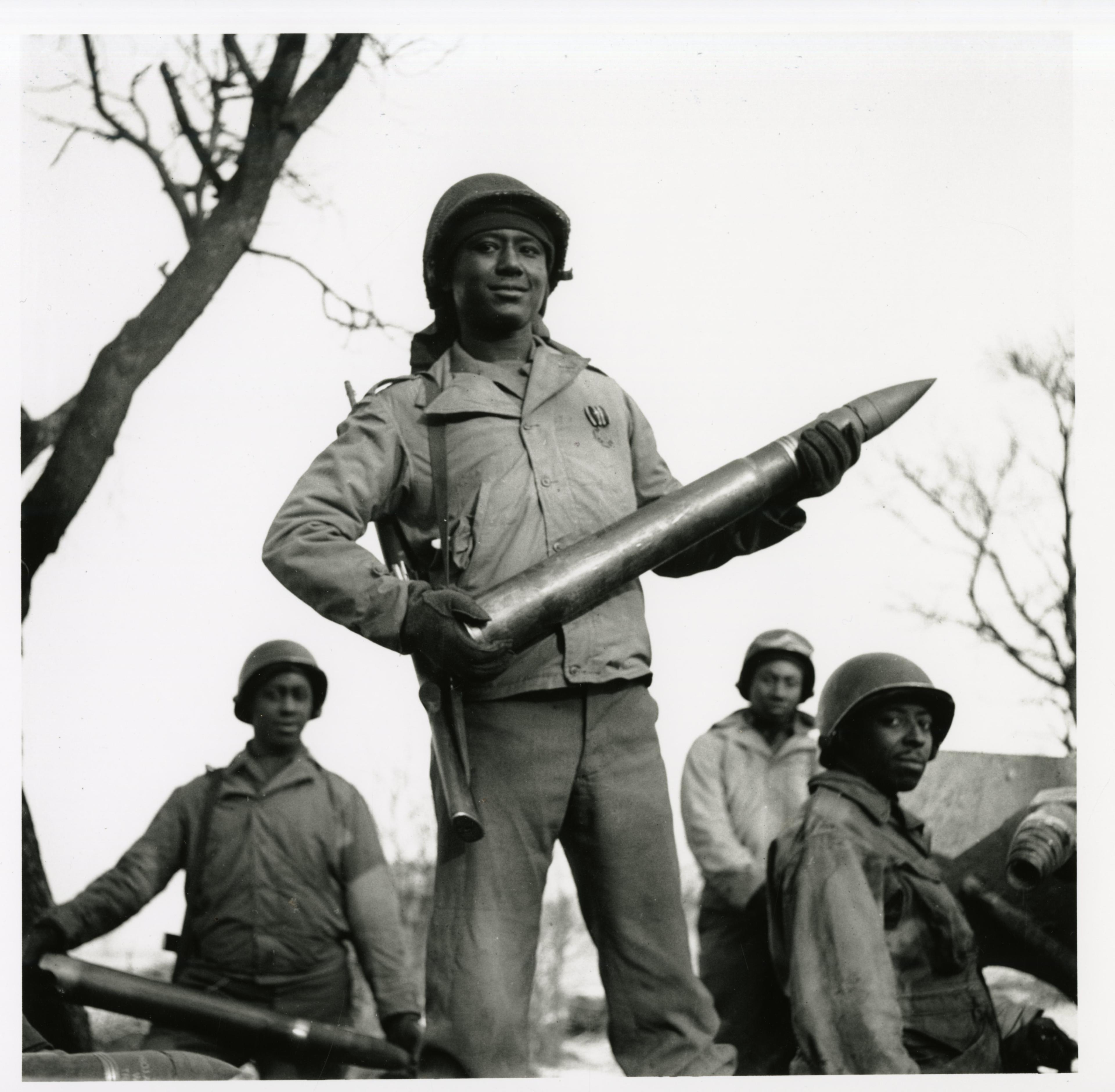 Historical image showing A soldier of the 614th Tank Destroyer Battalion of Black American soldiers during WWII