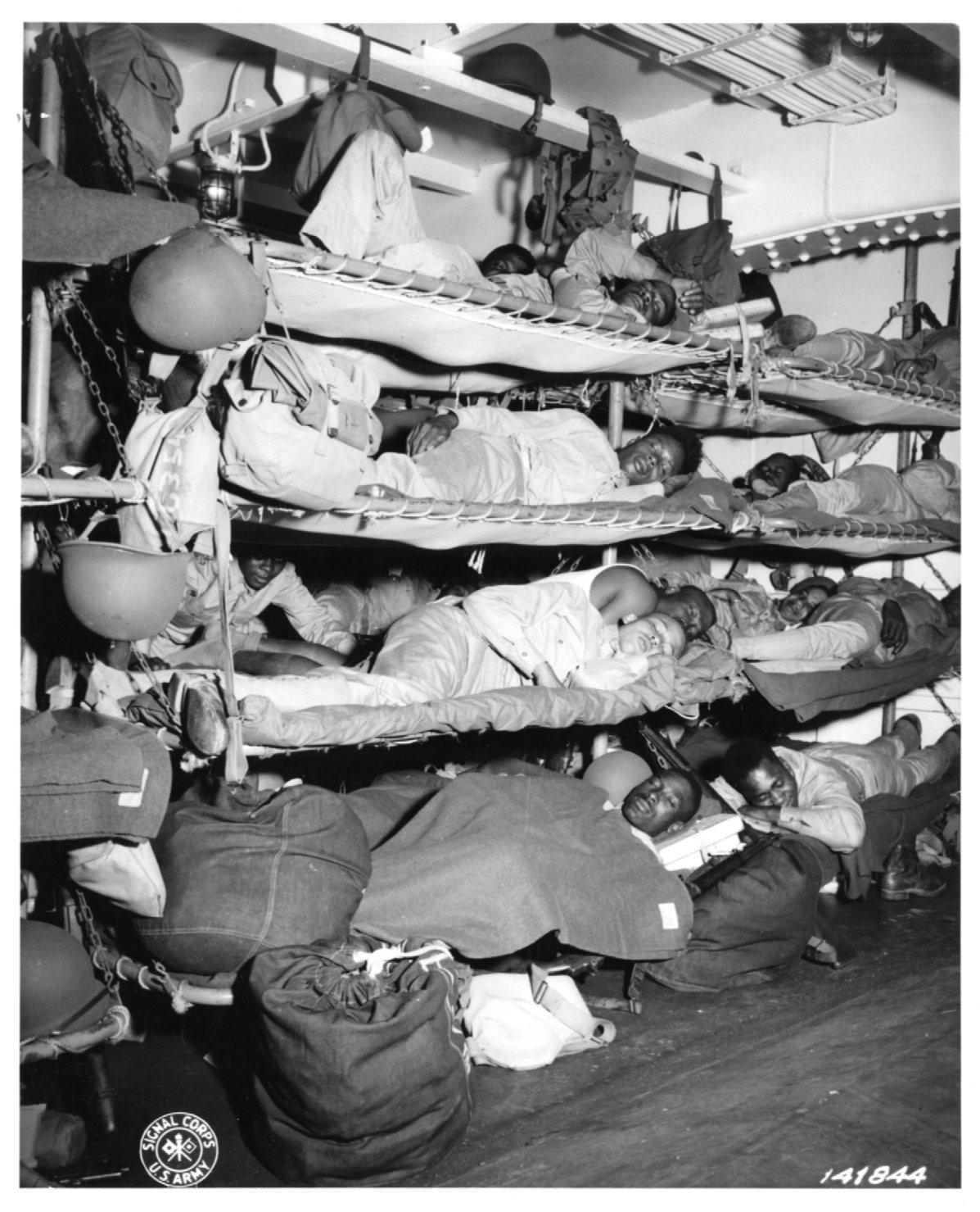 Historical image showing Soldiers of the 76th Coast Artillery Regiment asleep of Black American soldiers during WWII