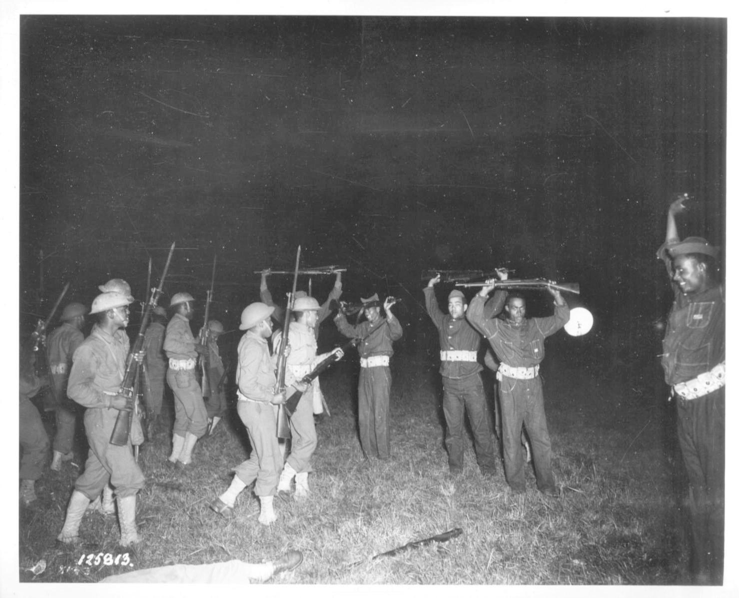 Historical image showing Soldiers of the 76th or 77th Coast Artillery Regiment during a training exercise of Black American soldiers during WWII