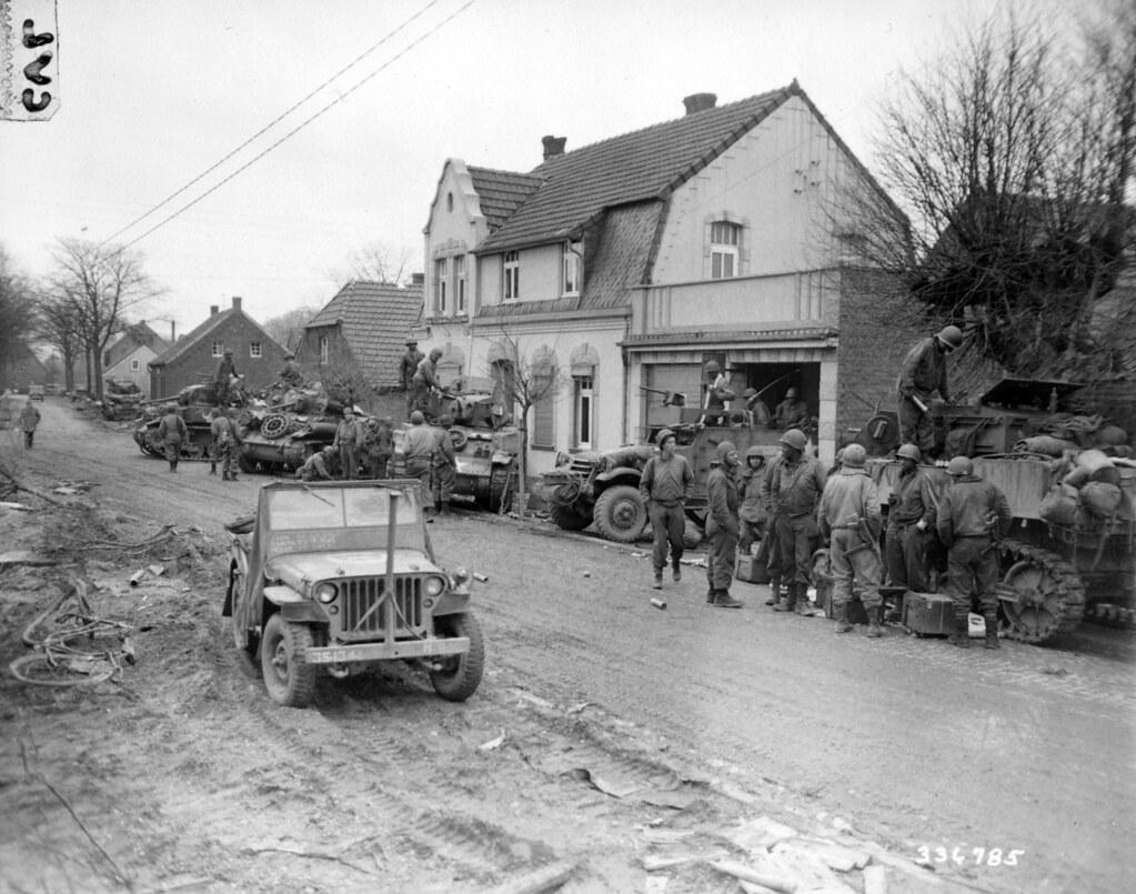 Historical image showing The remaining tanks of the Byrne Task Force are serviced by their crews. of Black American soldiers during WWII