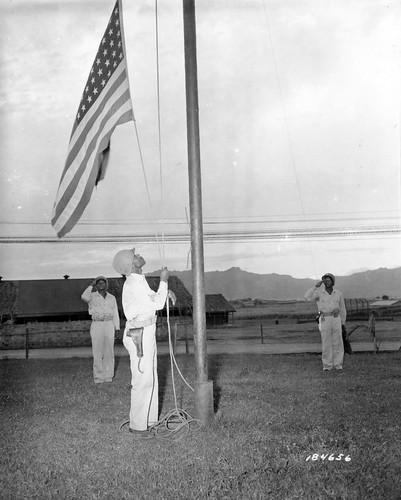 Historical image showing A retreat ceremony somewhere in the South Pacific Area. of Black American soldiers during WWII