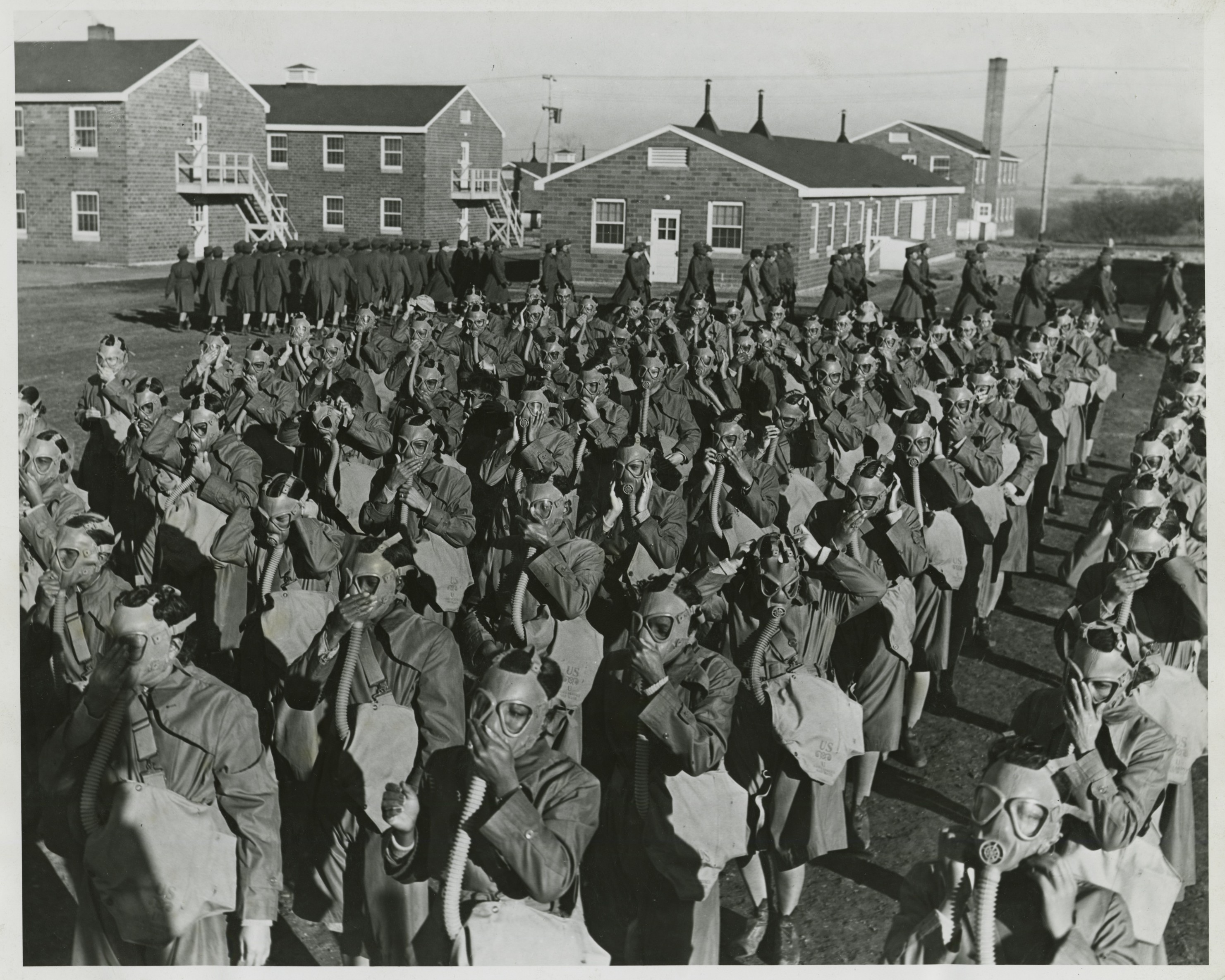 Historical image showing Black Americans of the Women's Army Auxiliary Corps receive gasmask training. of Black American soldiers during WWII
